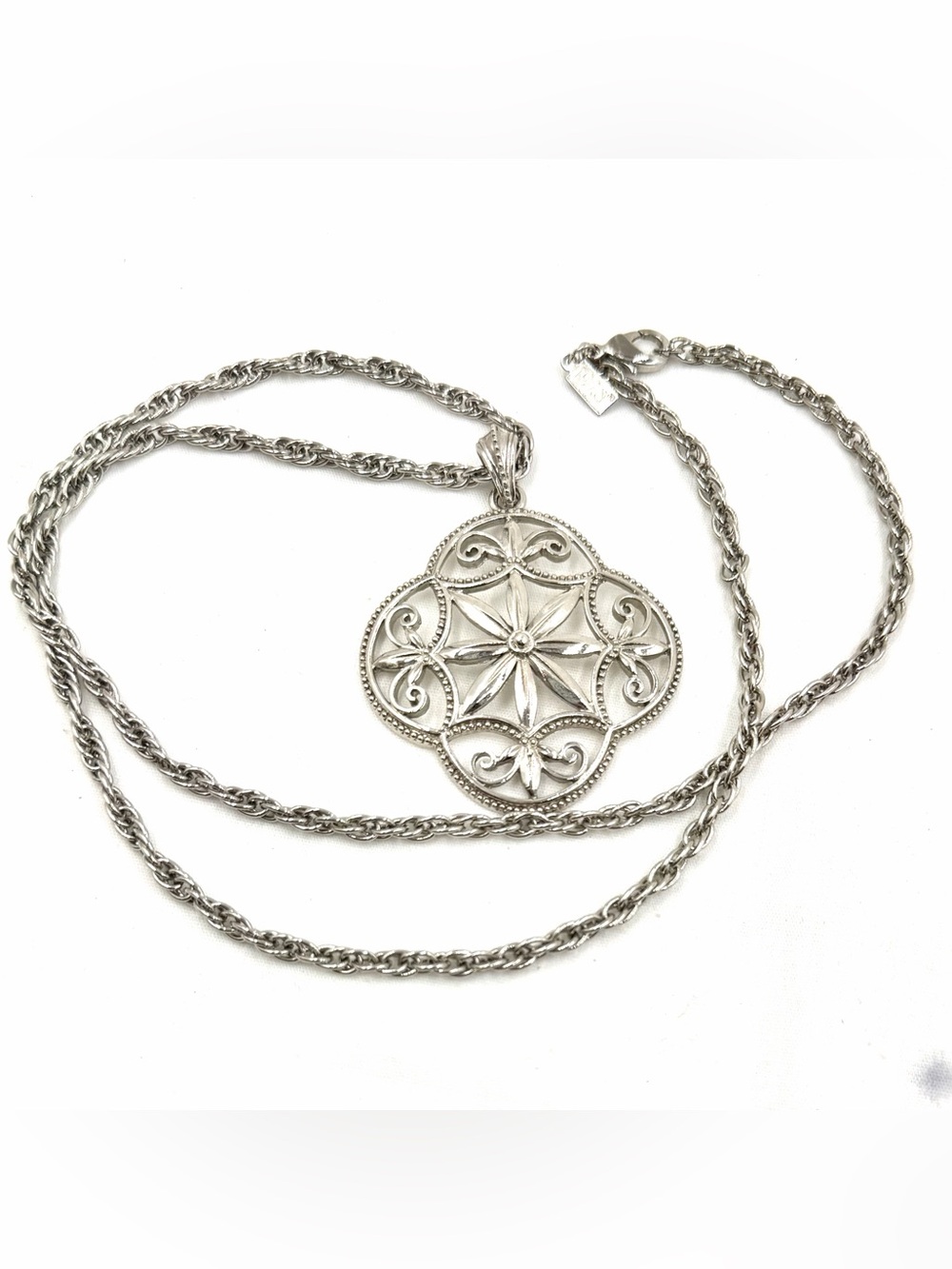 This 1928 Brand silver-tone necklace floral filigree medallion pendant